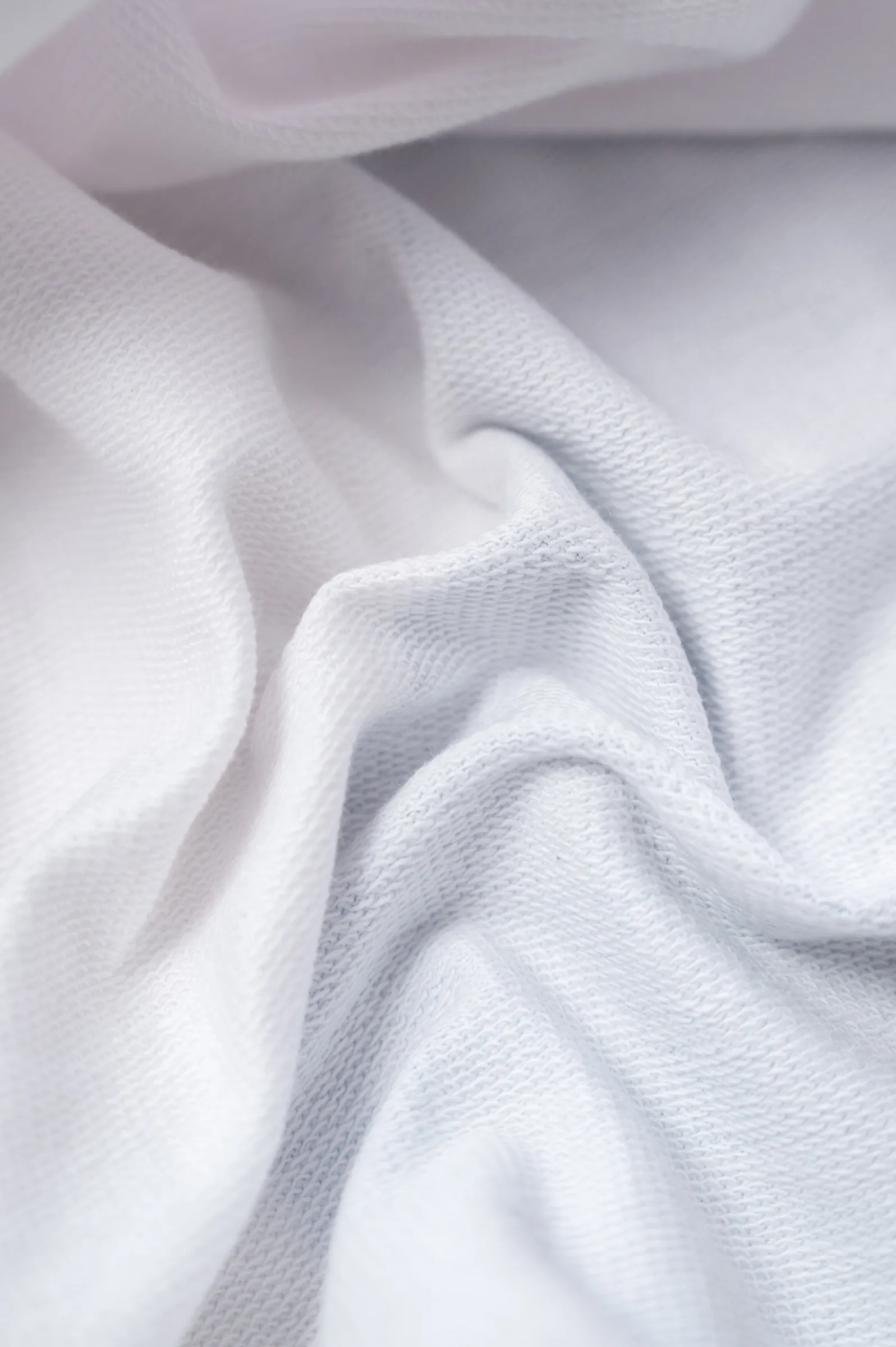 Close-up of the white 240 GSM loopknit French terry fabric
